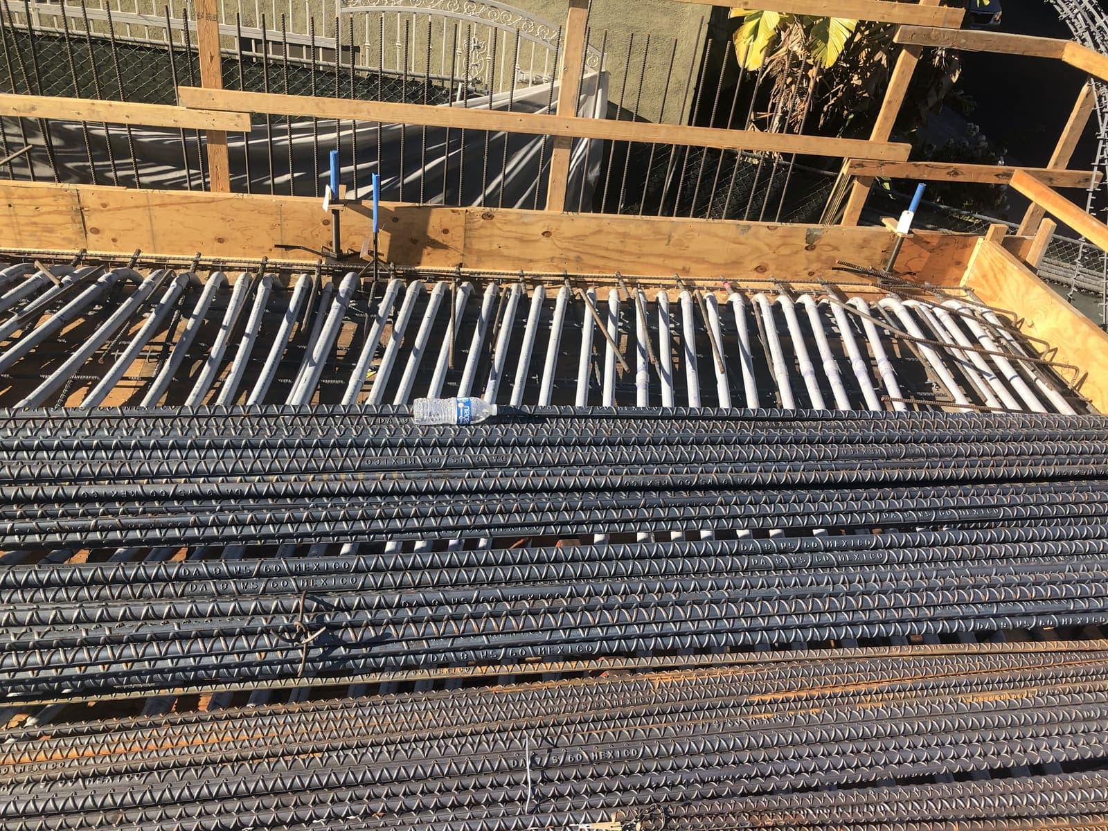 Vertical rebar cage and column reinforcement with conduit